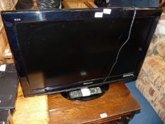 A Panasonic flat screen TV with remote, 31'' screen.
