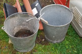 Two galvanised metal pails.