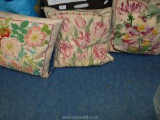 A bag of tapestry cushions