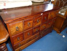 An Eastern chest of 12 short over 4 long drawers, 48'' wide x 13'' deep x 30 1/2'' high.