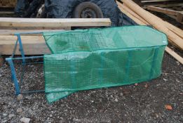 A small plastic cover greenhouse with mesh shelves, 69" high x 18" deep x 23" wide.