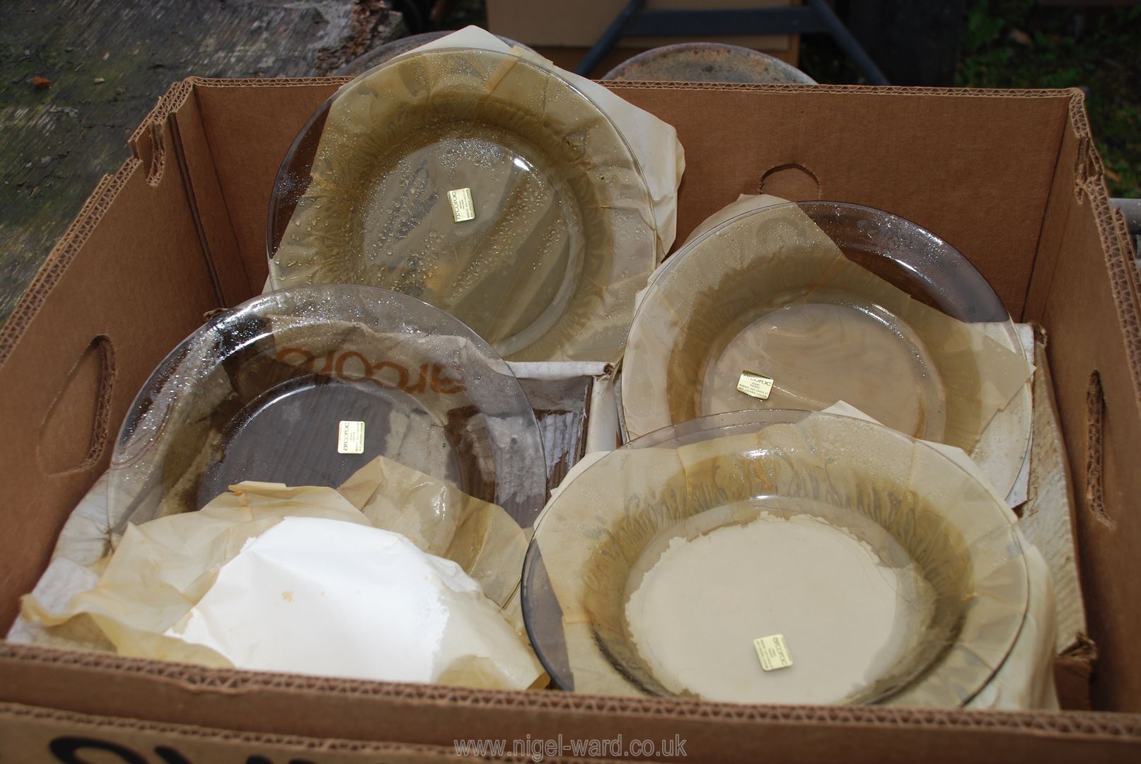 A box of Arcoroc glass kitchenware.