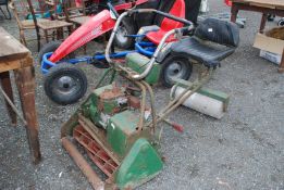 An Atco cylinder mower, 24'' cut, with seat and roller, (engine turns).