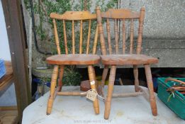 Two pine kitchen chairs.