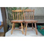 Two pine kitchen chairs.