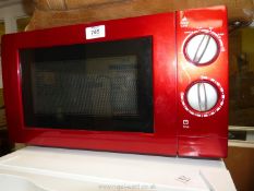 A red microwave oven