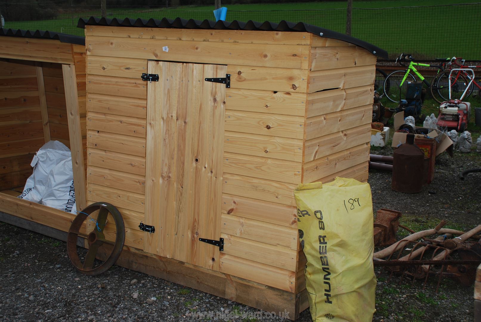 A timber shed 62" x 31" x 5` high