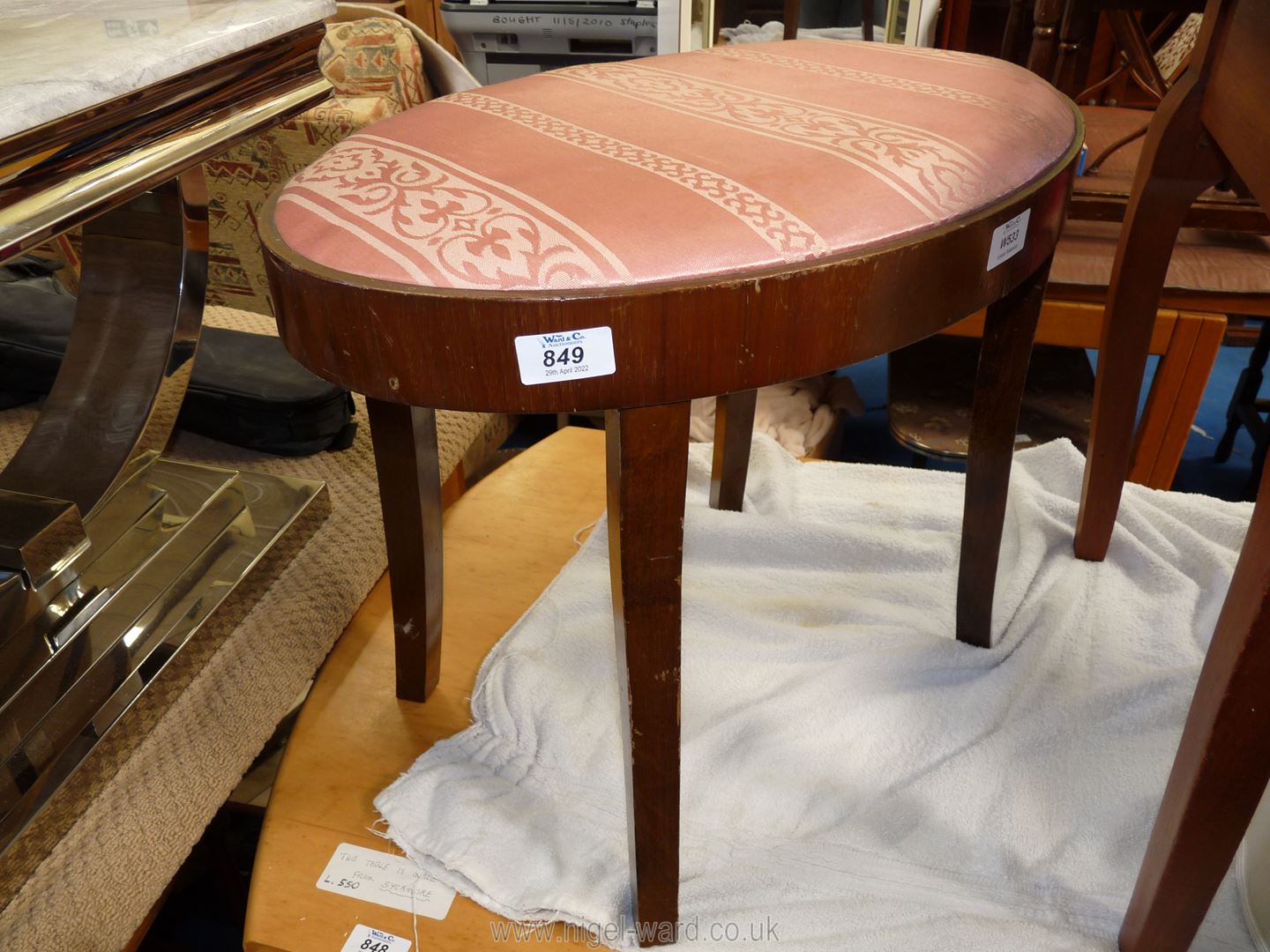 An oval dressing table stool.