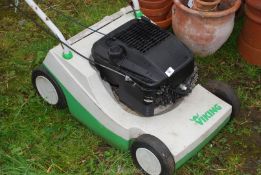 A Viking Briggs & Stratton engine lawn mower, no grass box (running at time of cataloguing).