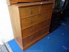 A light Oak chest of drawers by Heal & Son London, 42" wide x 21" deep x 42" high.