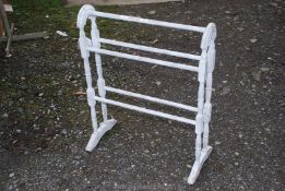 A wooden shabby chic painted towel rail.