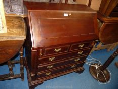 A reproduction bureau with sliders, 29" W x 34 1/2" H.