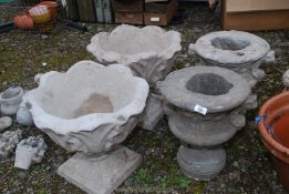 Two tulip concrete vases and two urns.