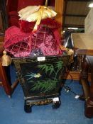 A black lacquered oriental, metal lined, plant Stand with assorted small cushions etc,