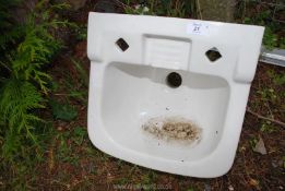 A small porcelain hand basin.