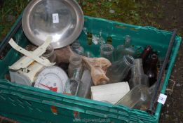 A box of old bottles, scales, etc.