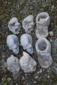 Concrete boots and garden ornaments, eight in total.
