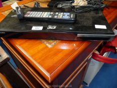 A Samsung BluRay 3D DVD player with remote