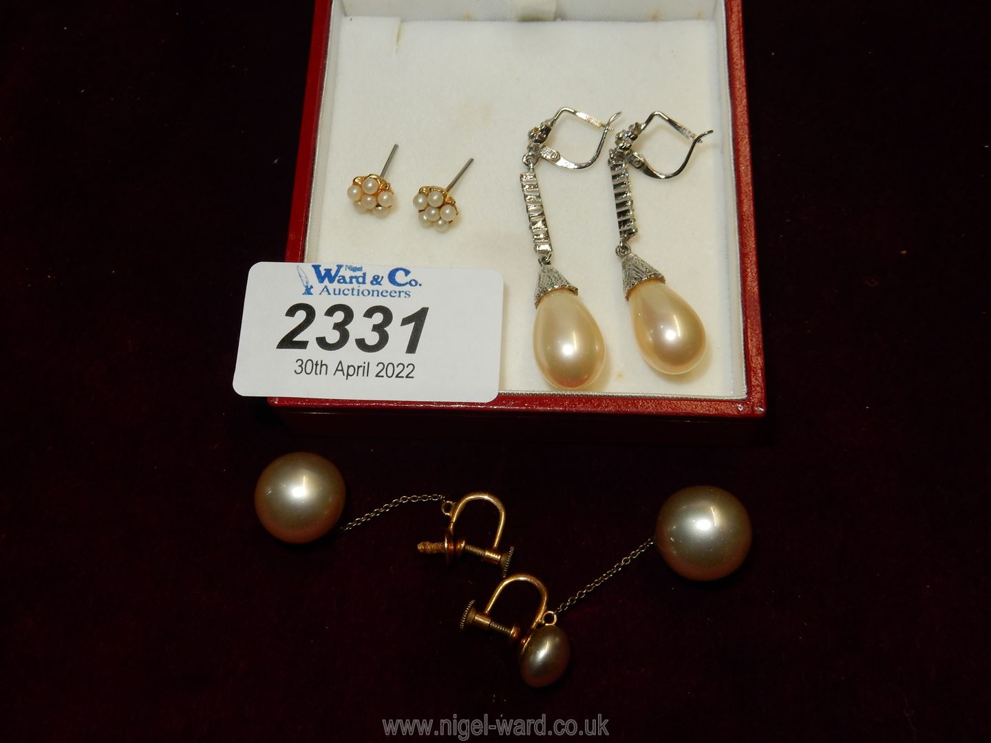 Three pairs of simulated pearl earrings including screw back and pierced sets.