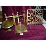 A small quantity of brass including a book stand, miniature table,