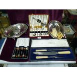 A quantity of EPNS including a cased carving set, cased set of berry spoons, serving dishes etc.