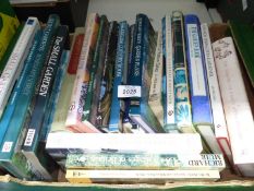 A box of Gardening books.