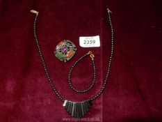 A Hematite necklace and bracelet together with a mixed Agate 'Miracle' brooch.