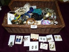 A quantity of costume jewellery including clip on earrings, bangles, bracelets, etc.