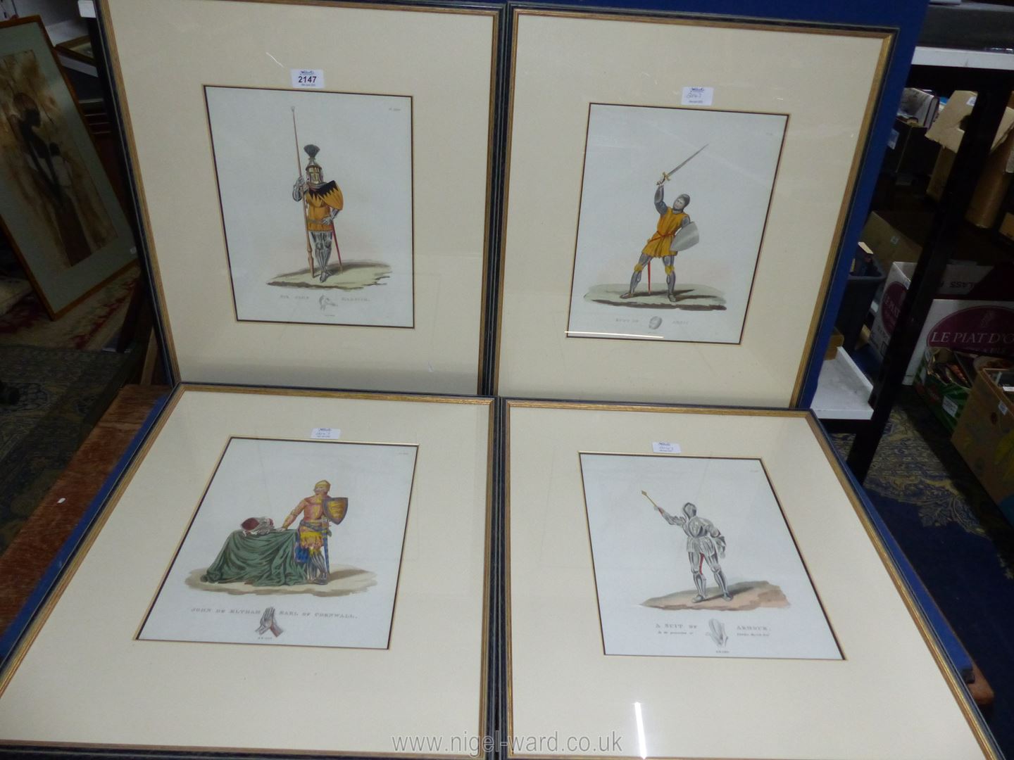 Four framed and mounted Plates depicting Men in Armour titled 'A Suit of Armour in the possession