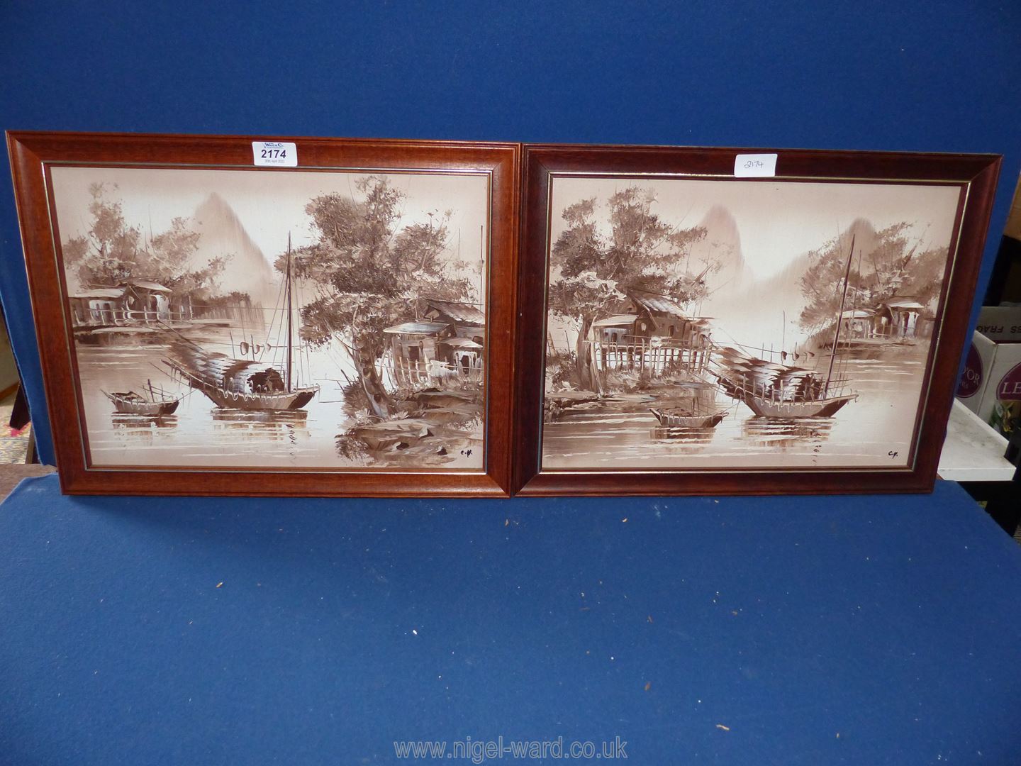 A pair of oriental River scenes, initialed lower right C.Y., in brown tones, 17 3/4" x 14".