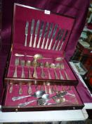 A dark wood Canteen of Cutlery, marked Osborne to the knife blades, some pieces missing.