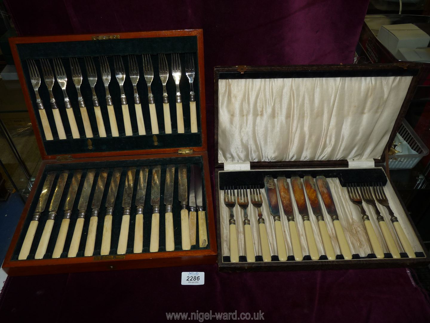 A wooden canteen of bone handled cutlery (incomplete) and a cased set of fish eaters,