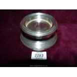 A round silver stand hallmarked 925 Birmingham 2000, maker B & Co., 4 3/4" diameter.