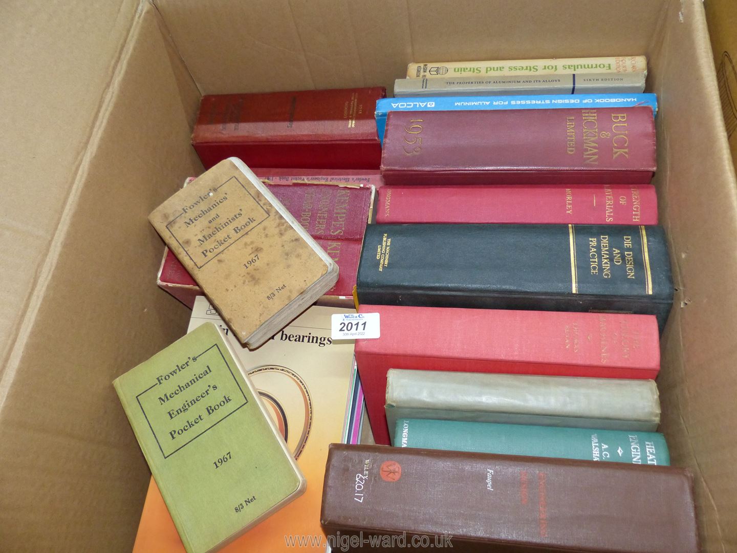 A box of books including Buck & Hickman Ltd.