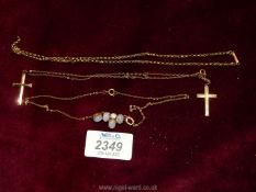 A small quantity of jewellery including 9 ct gold and rolled gold crosses and a necklace set with
