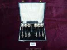 A boxed set of six Silver teaspoons and sugar tongs, Birmingham makers Marples & Co,