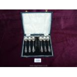 A boxed set of six Silver teaspoons and sugar tongs, Birmingham makers Marples & Co,