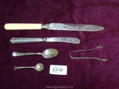 A small quantity of hallmarked Sheffield silver including 1907 sugar tongs, 1908 teaspoon,,