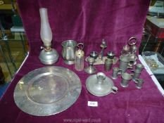 A quantity of plated items including a set of four centilitres measures, cruet set, chamberstick,