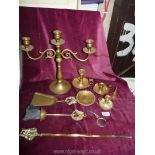 A small quantity of brass including a candlestick, chamber-sticks, fire irons, etc.