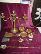 A small quantity of brass including a candlestick, chamber-sticks, fire irons, etc.