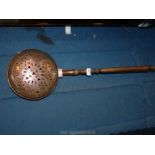 A Copper warming pan with wooden handle, 31'' long overall.