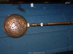 A Copper warming pan with wooden handle, 31'' long overall.