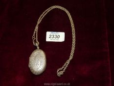 A silver Locket, Birmingham 1881, makers H.P.O on a rope twist chain.