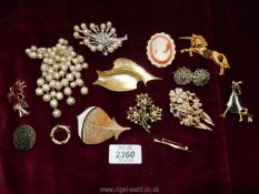 A quantity of costume jewellery brooches in basket