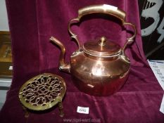 A Copper kettle (a/f) and a brass trivet.