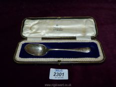 A cased Silver Spoon, Sheffield 1910, makers Joseph Rodgers & Sons, 35gms.