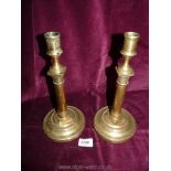 A pair of brass Candlesticks with hammered detail.