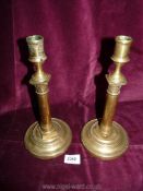 A pair of brass Candlesticks with hammered detail.