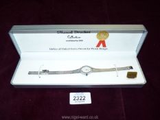 A boxed Marcel Drucker ladies white metal wristwatch.